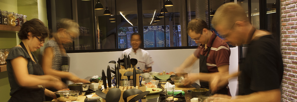Students plating their dishes with the chef at La Table Khmère