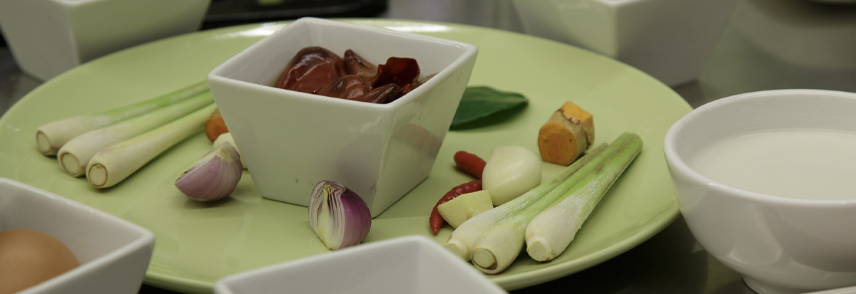 Fresh lemongrass, galangal, shallots and chilli paste prepared for a Khmer recipe
